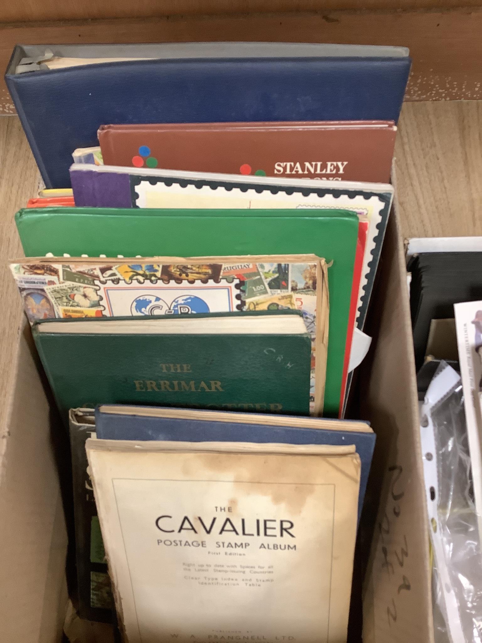 A postcard album, 10 assorted medals postcards and silks and first day covers